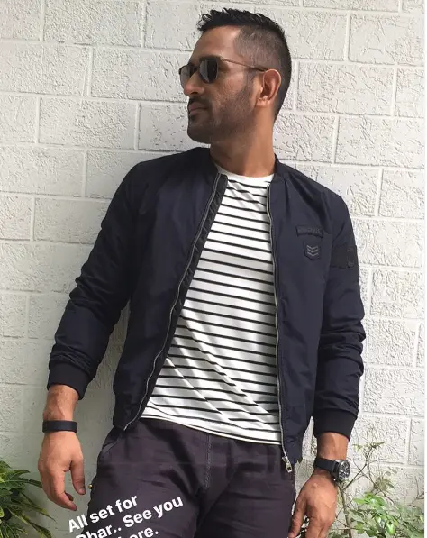 "Portrait of MS Dhoni, the legendary Indian cricketer, smiling in a casual setting, showcasing his vibrant personality at the age of 42."