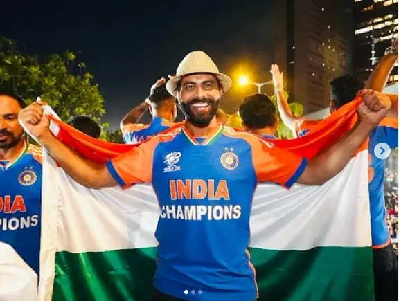 "Ravindra Jadeja smiling during a cricket match in his Indian team jersey, showcasing his youthful energy and focus."

