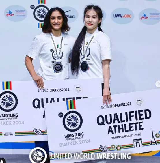 Alt Text:
"Vinesh Phogat standing tall in a wrestling stance, showcasing her athletic physique."