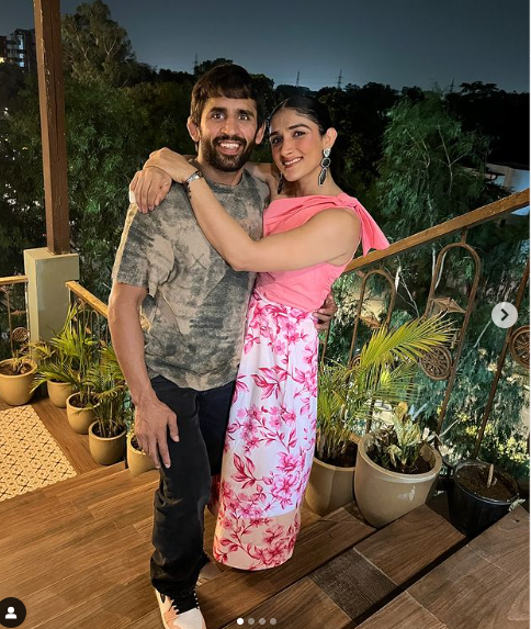 Sangeeta Phogat, Indian wrestler and wife of Bajrang Punia, standing confidently in her athletic gear, showcasing her strength and dedication to wrestling.