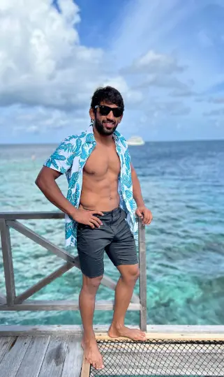 Bajrang Punia, Indian wrestler, currently 30 years old, standing confidently in his athletic gear.

