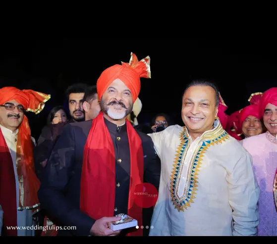 Anil Ambani, Indian businessman, maintaining a fit physique, dressed in formal attire during a public event."