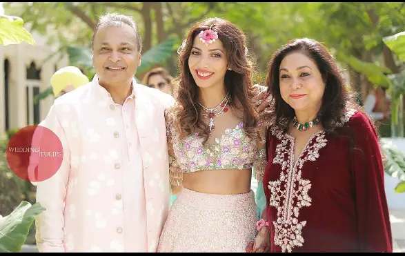 "Anil Ambani with his family, including wife Tina Ambani and sons Jai Anmol and Jai Anshul, posing together in an elegant setting."