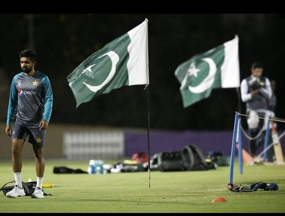 Young Babar Azam in action during his debut match, showcasing his batting skills with focus and determination.