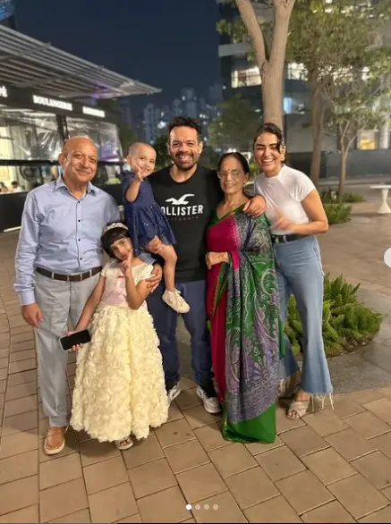 A heartwarming family photo of Gaurav Taneja, his wife Ritu Rathee Taneja, and their daughters, known for their vlogs and family moments shared online.