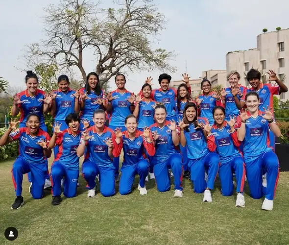 Arundhati Reddy delivering a powerful bowling spell during her debut match, showcasing her determination and skill on the cricket field.